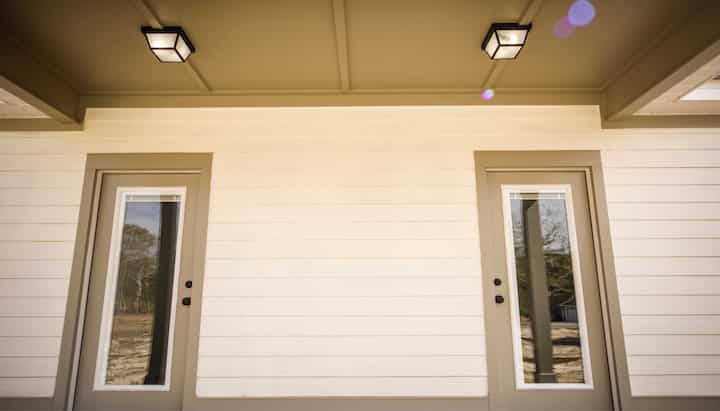 We offer siding services in Rochester, New York. Hardie plank siding installation in a front entry way.